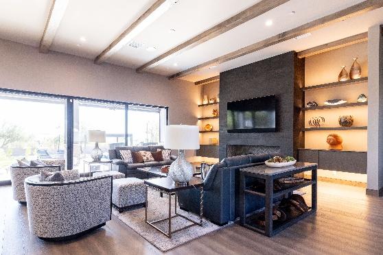 A living room with a tv and couchesAI-generated content may be incorrect.