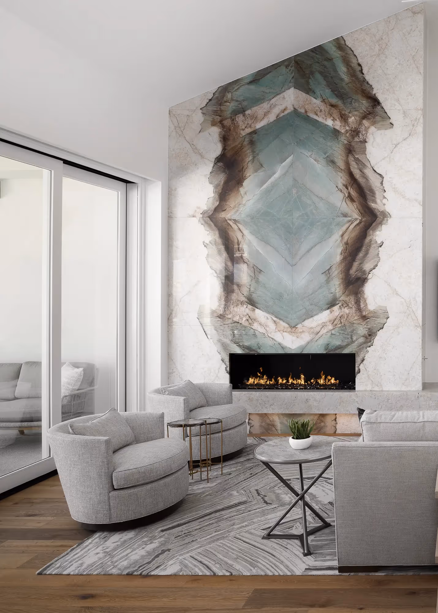 Bookmatched quartzite fireplace living room scottsdale wellness home | Sesshu Design Associates